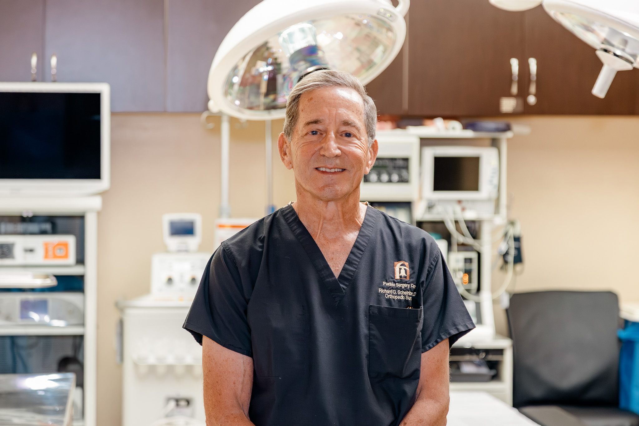 Dr. Scheinberg in scrubs in the procedure room