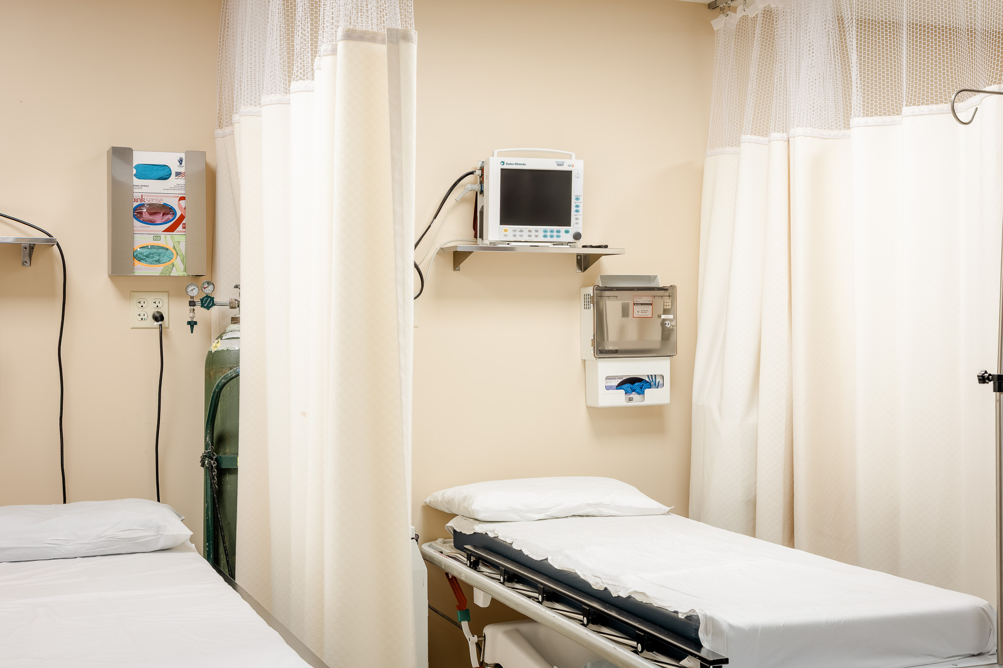 A recovery bay with a bed and monitor