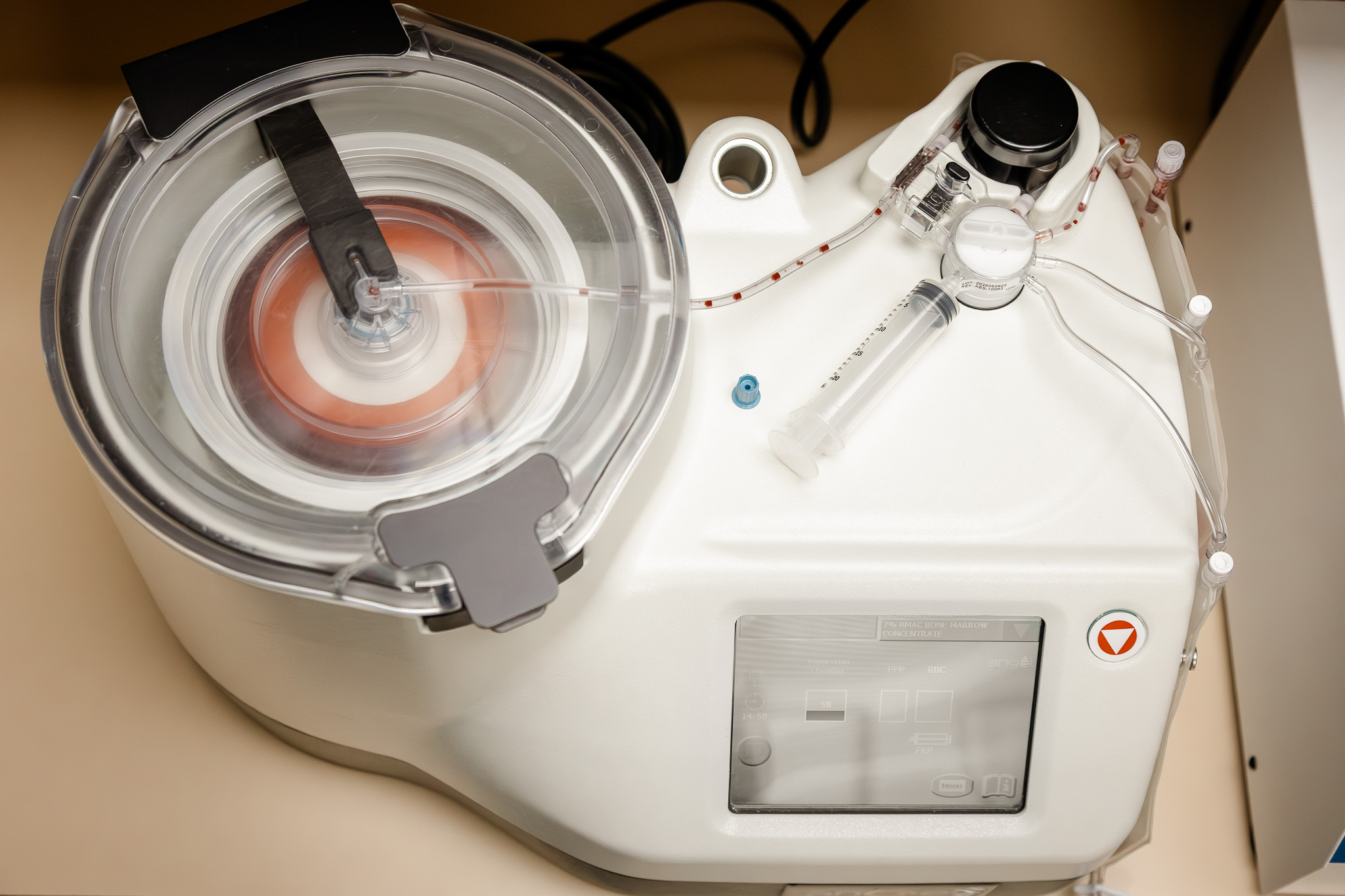 Processing equipment with a spinning sample chamber
